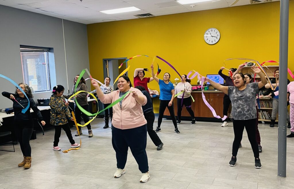 A group of individuals participating in our 2023 Fall Alma Ritmica Dance program, aimed at promoting physical and mental well-being through movement and social interaction.