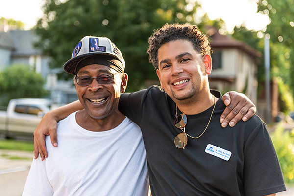 Simpson Housing Services' employee posing with client