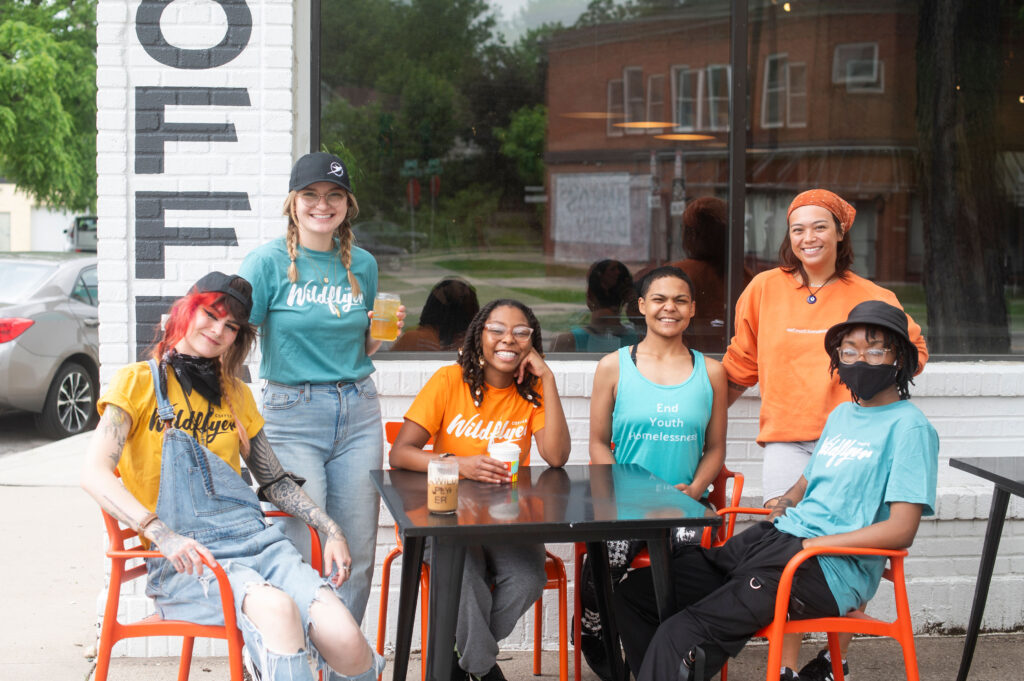 Wildflyer Coffee employee participants enjoying a beverage outside of the retail store