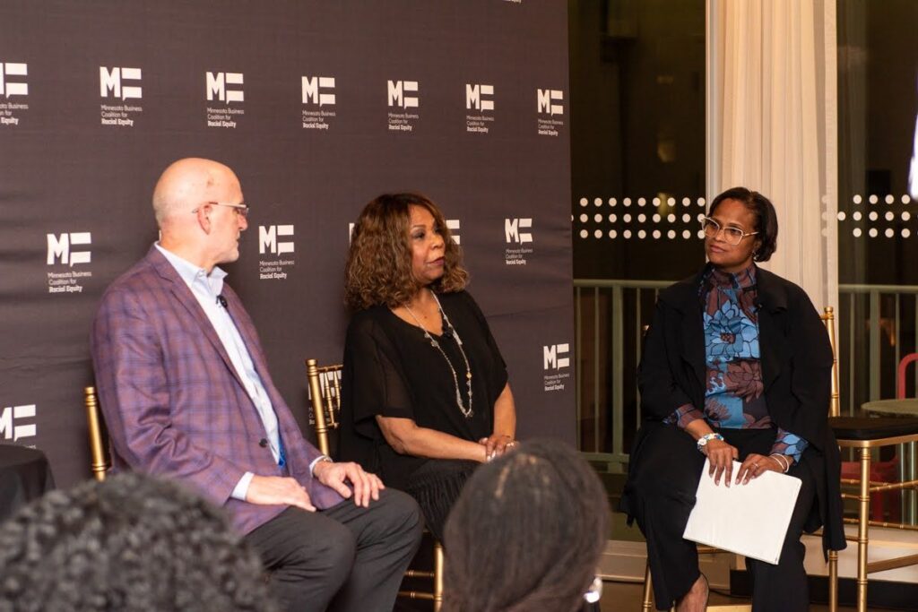 Miquel McMoore moderating a panel at a Minnesota Business Coalition for Racial Equity event